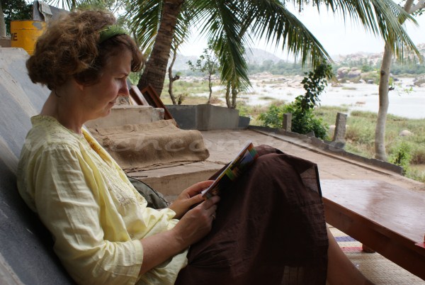 Mum reading a book in front of the lovely view